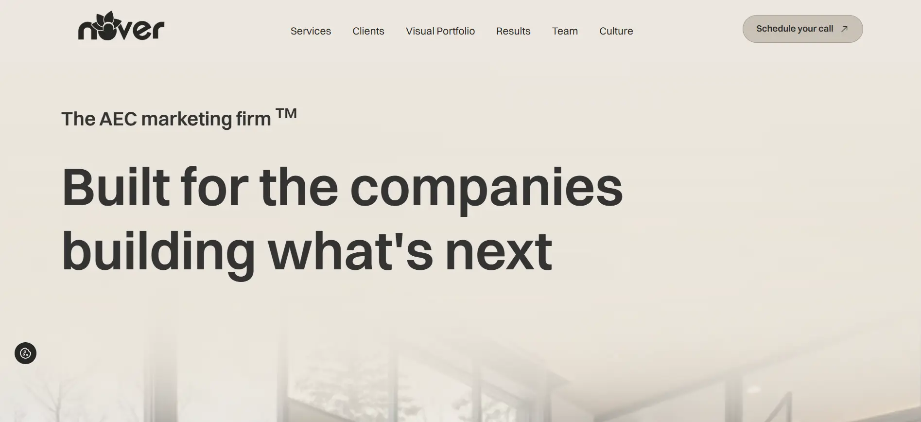 Text on cream background with blurred office interior and navigation menu