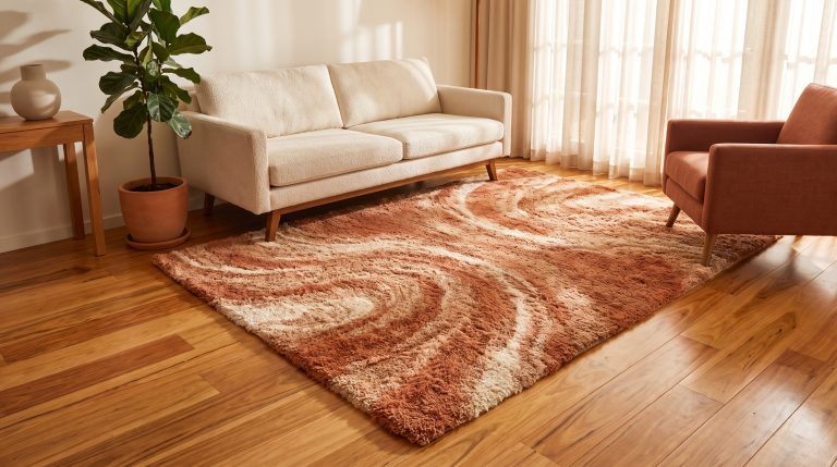 Contemporary living room with beige sofa, terracotta armchair, and textured rug on wooden floor